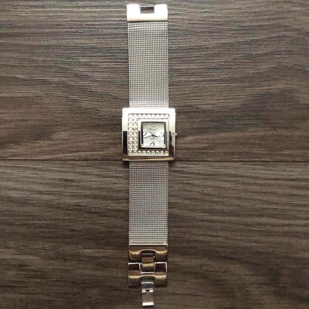 Silver watch, with stones around face, from Vivah